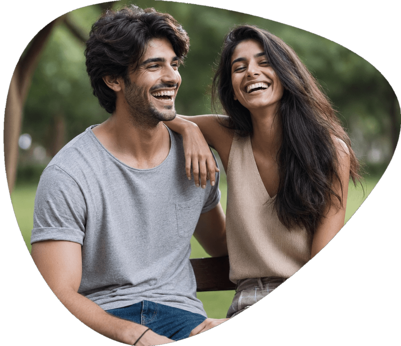 A smiling couple sitting together outdoors